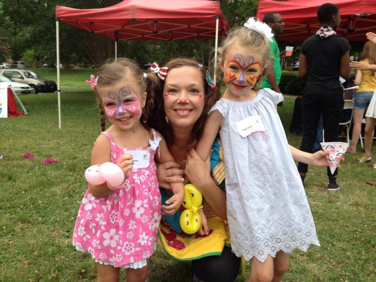 Children loving their butterfly face paint done by Corky the Clown Light version