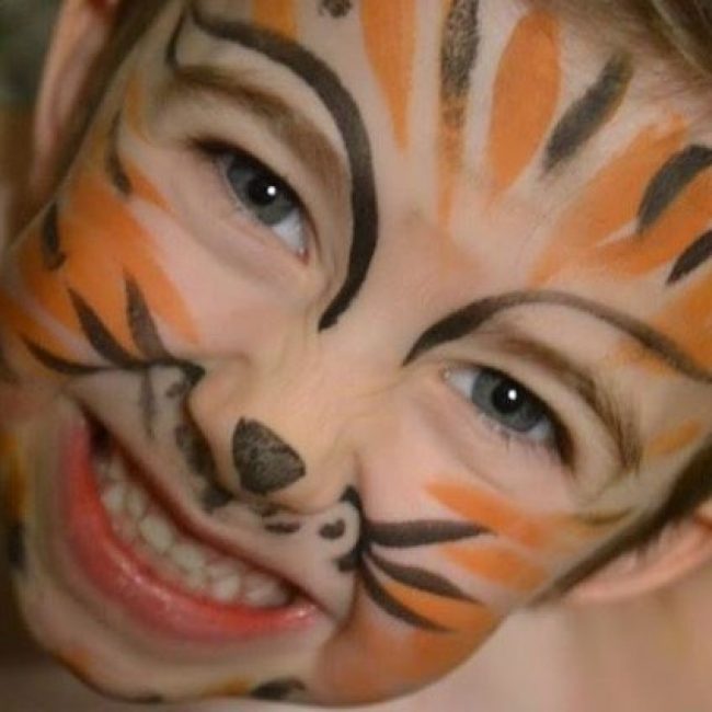 Corky Magic painted little boy's face like a tiger