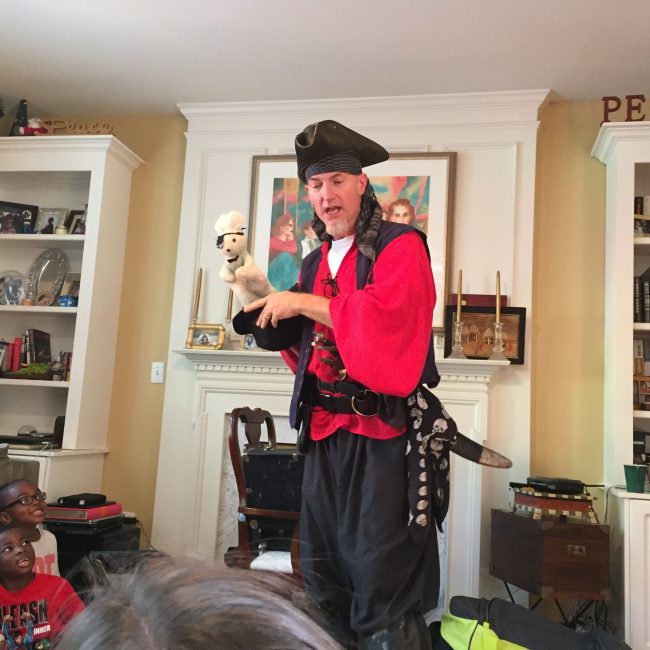 Pirate doing magic tricks at birthday party